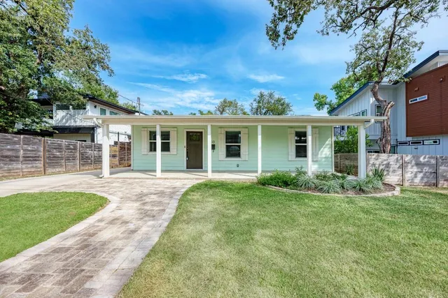 front view of a house with a yard