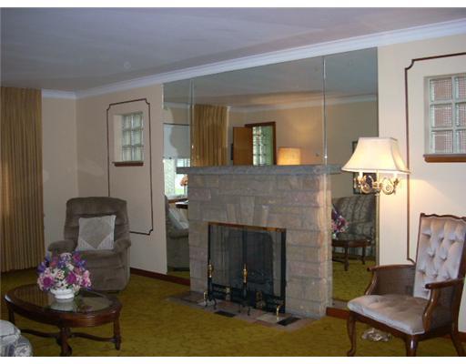 216 Amelia Street McKees Rocks, PA 15136 - Photo 2 of 13 Living Room. Beautiful living room with stone fireplace and 2 large windows