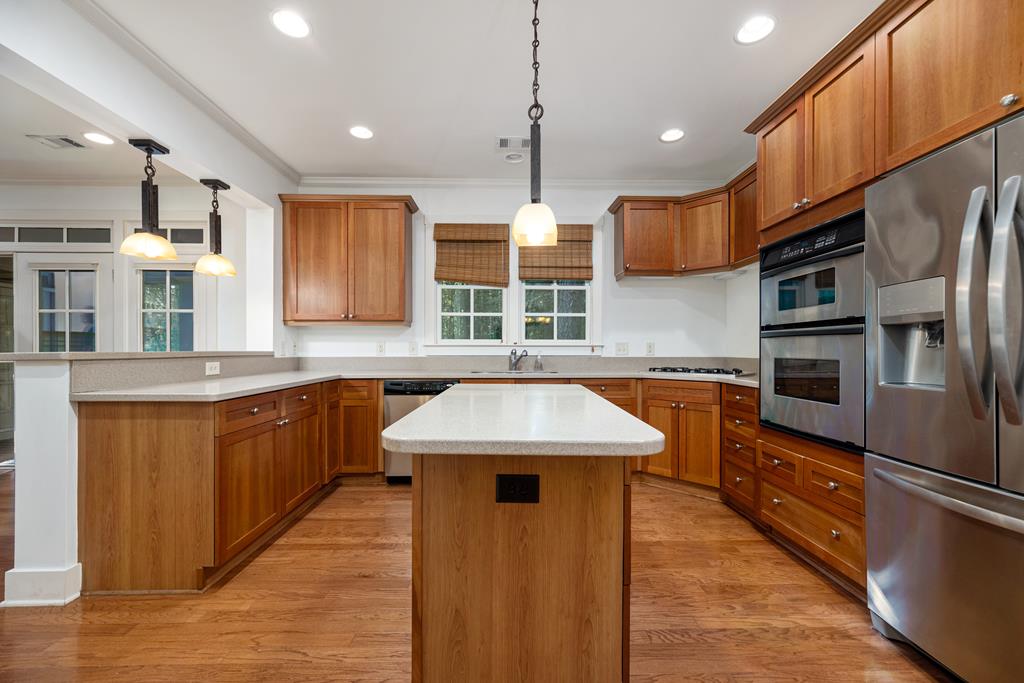 142 Maple Trace Pine Mountain, GA 31822 - Photo 14 of 61 a kitchen with stainless steel appliances granite countertop a sink a stove and a refrigerator
