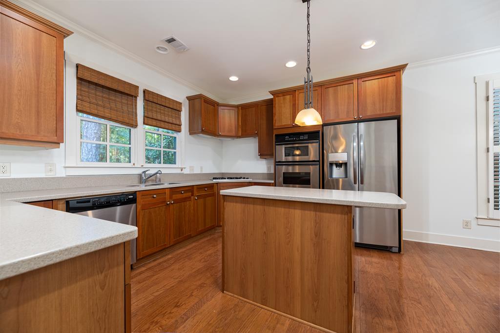 142 Maple Trace Pine Mountain, GA 31822 - Photo 16 of 61 a kitchen with stainless steel appliances granite countertop a sink a stove and a refrigerator