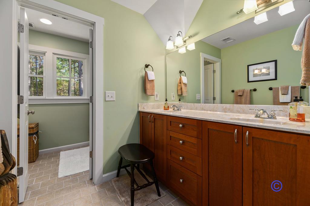 142 Maple Trace Pine Mountain, GA 31822 - Photo 20 of 61 a bathroom with a double vanity sink and a mirror