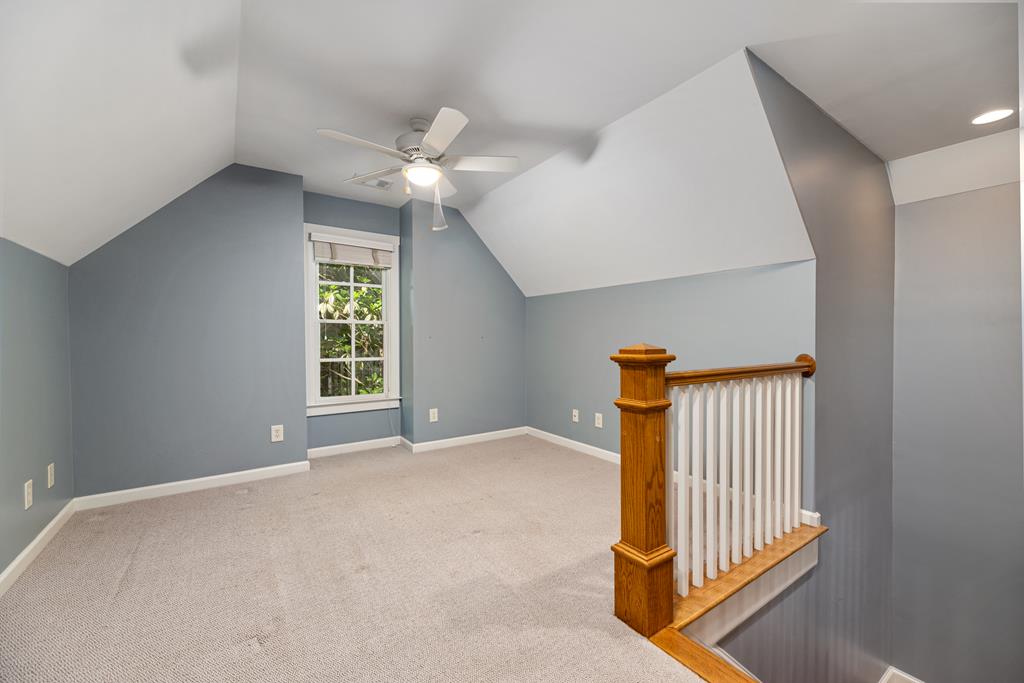 142 Maple Trace Pine Mountain, GA 31822 - Photo 23 of 61 en empty room with windows and ceiling fan