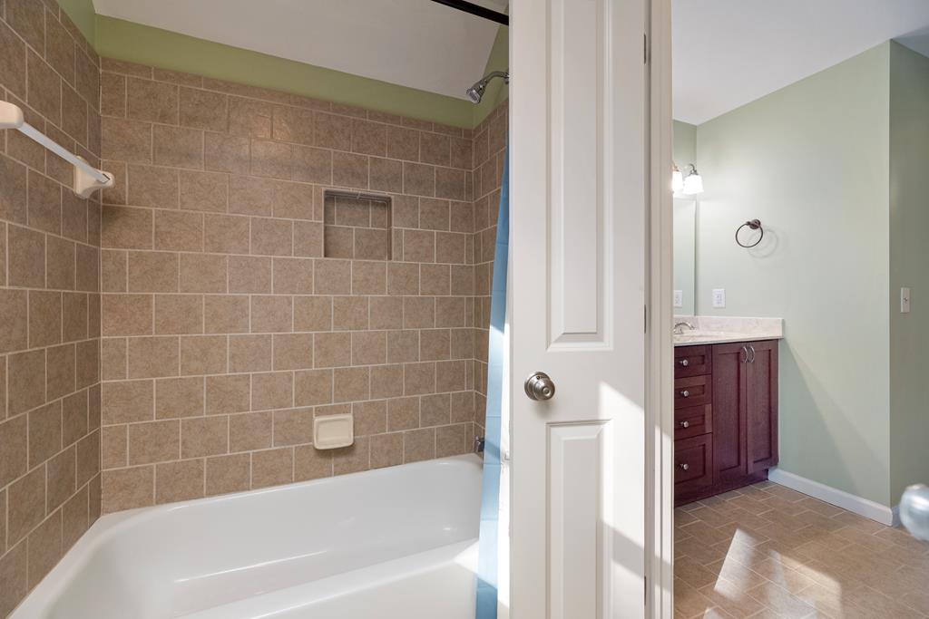 142 Maple Trace Pine Mountain, GA 31822 - Photo 27 of 61 a bathroom with a bathtub and a shower