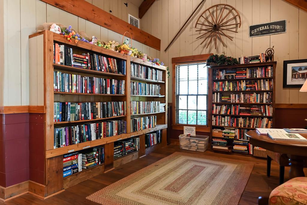 142 Maple Trace Pine Mountain, GA 31822 - Photo 38 of 61 a living room with furniture and a book shelf