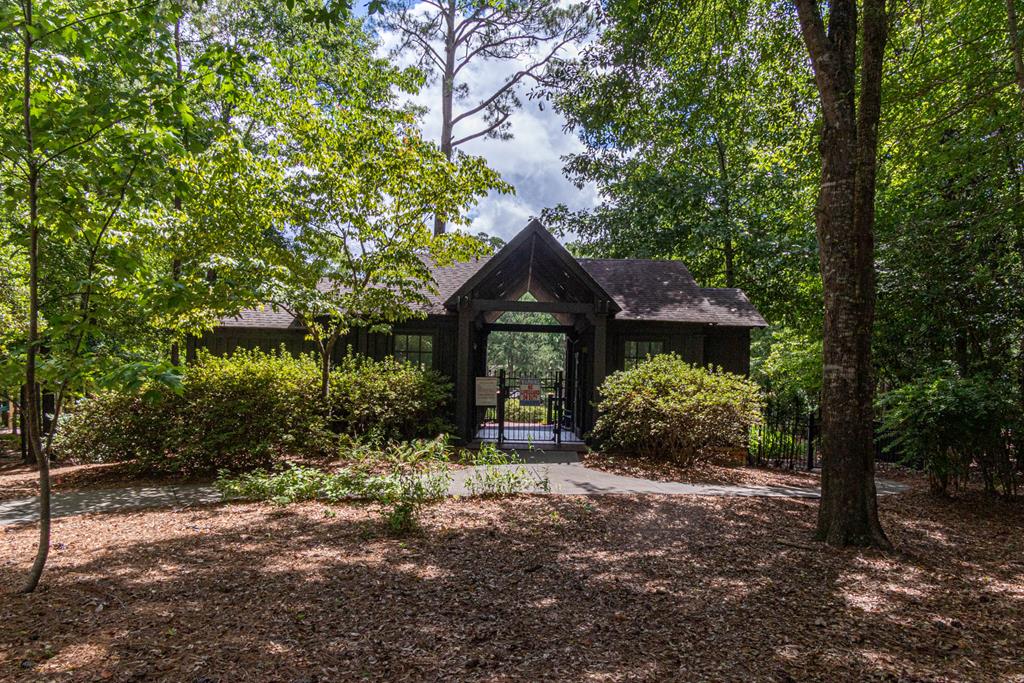 142 Maple Trace Pine Mountain, GA 31822 - Photo 46 of 61 a front view of a house with a yard and garage