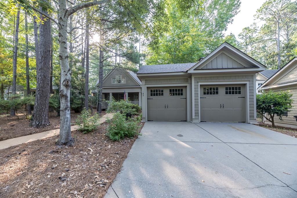 142 Maple Trace Pine Mountain, GA 31822 - Photo 49 of 61 a front view of a house with yard and trees