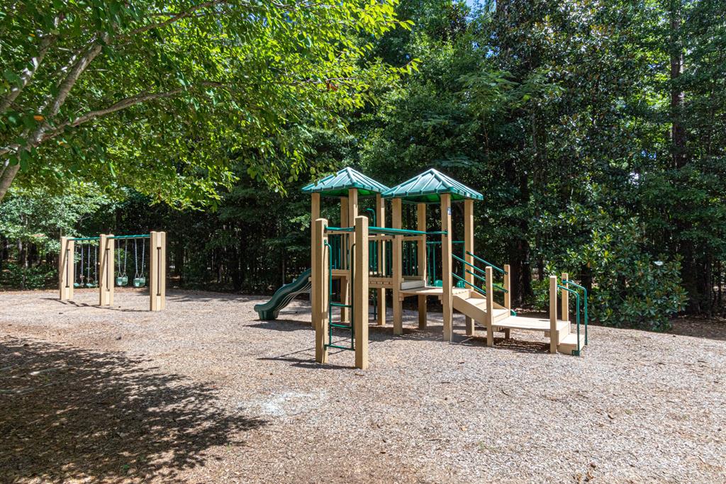 142 Maple Trace Pine Mountain, GA 31822 - Photo 50 of 61 a view of a house with backyard and a large tree