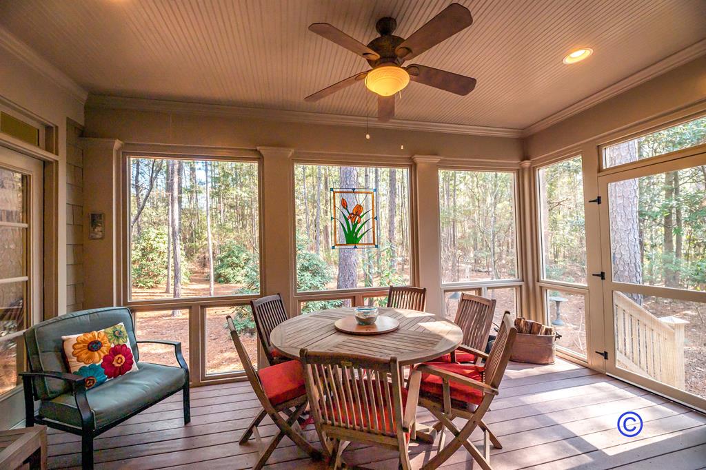 142 Maple Trace Pine Mountain, GA 31822 - Photo 6 of 61 a dining room with furniture a chandelier and wooden floor