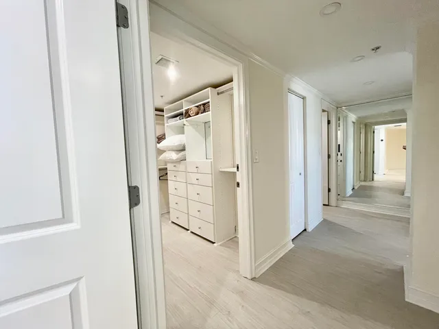 wooden floor with white walls