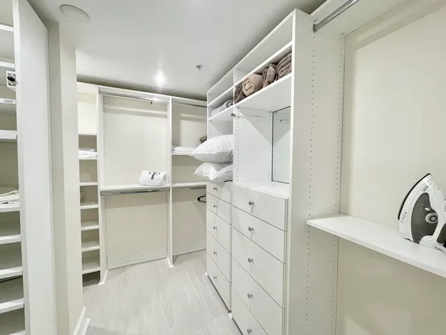 a bathroom with a bathtub sink and mirror