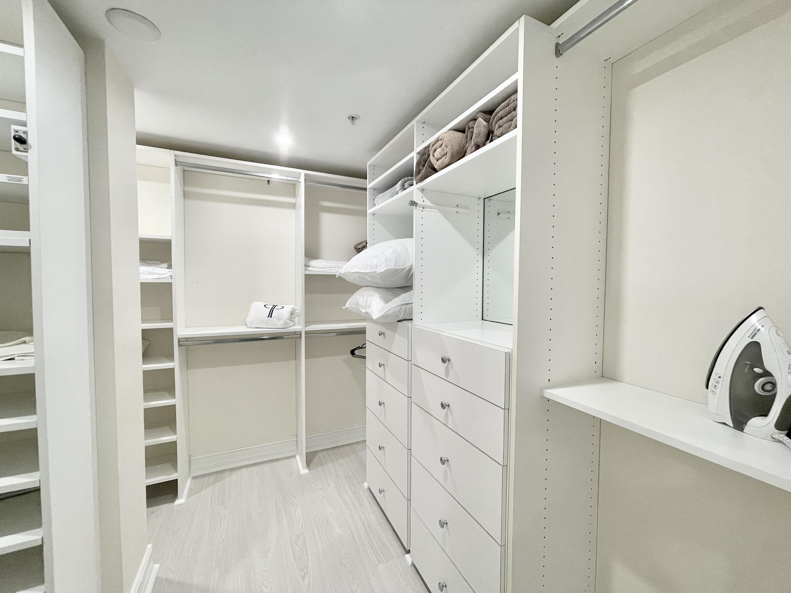 99 Southeast Mizner Boulevard, Unit PH5 Boca Raton, FL 33432 - Photo 15 of 48 a bathroom with a bathtub sink and mirror