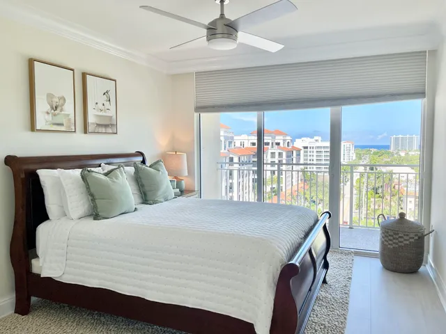 a bedroom with a large bed and a large window