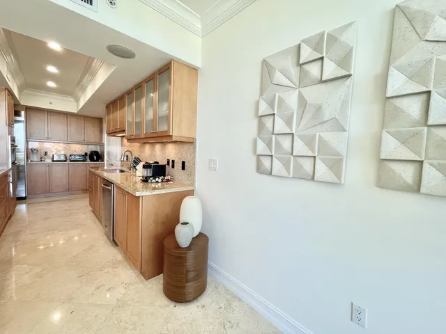 a kitchen with sink cabinets and window