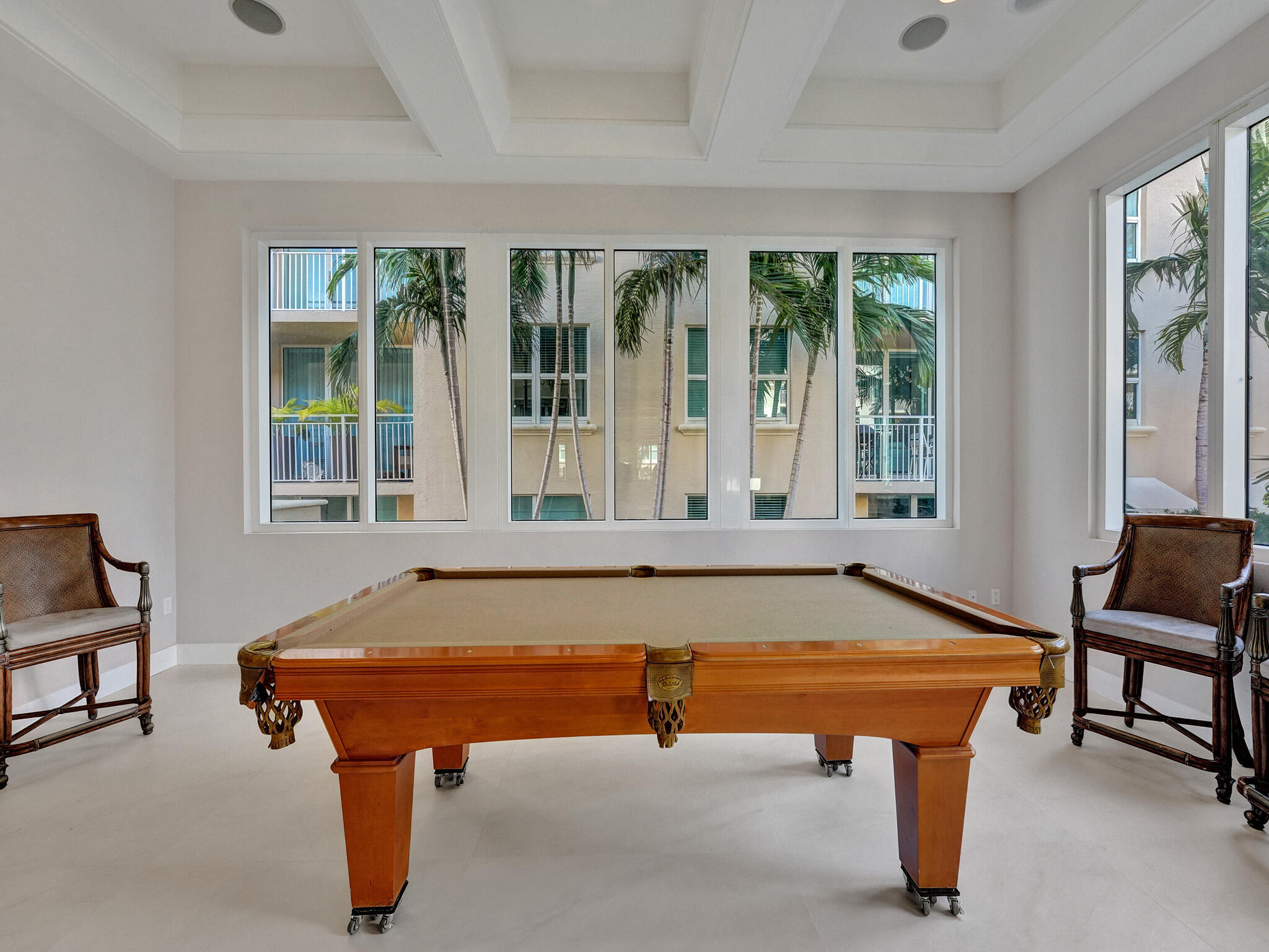 99 Southeast Mizner Boulevard, Unit PH5 Boca Raton, FL 33432 - Photo 37 of 48 a room with furniture pool table and windows