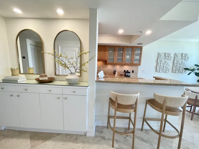 a living room with granite countertop furniture and a large window