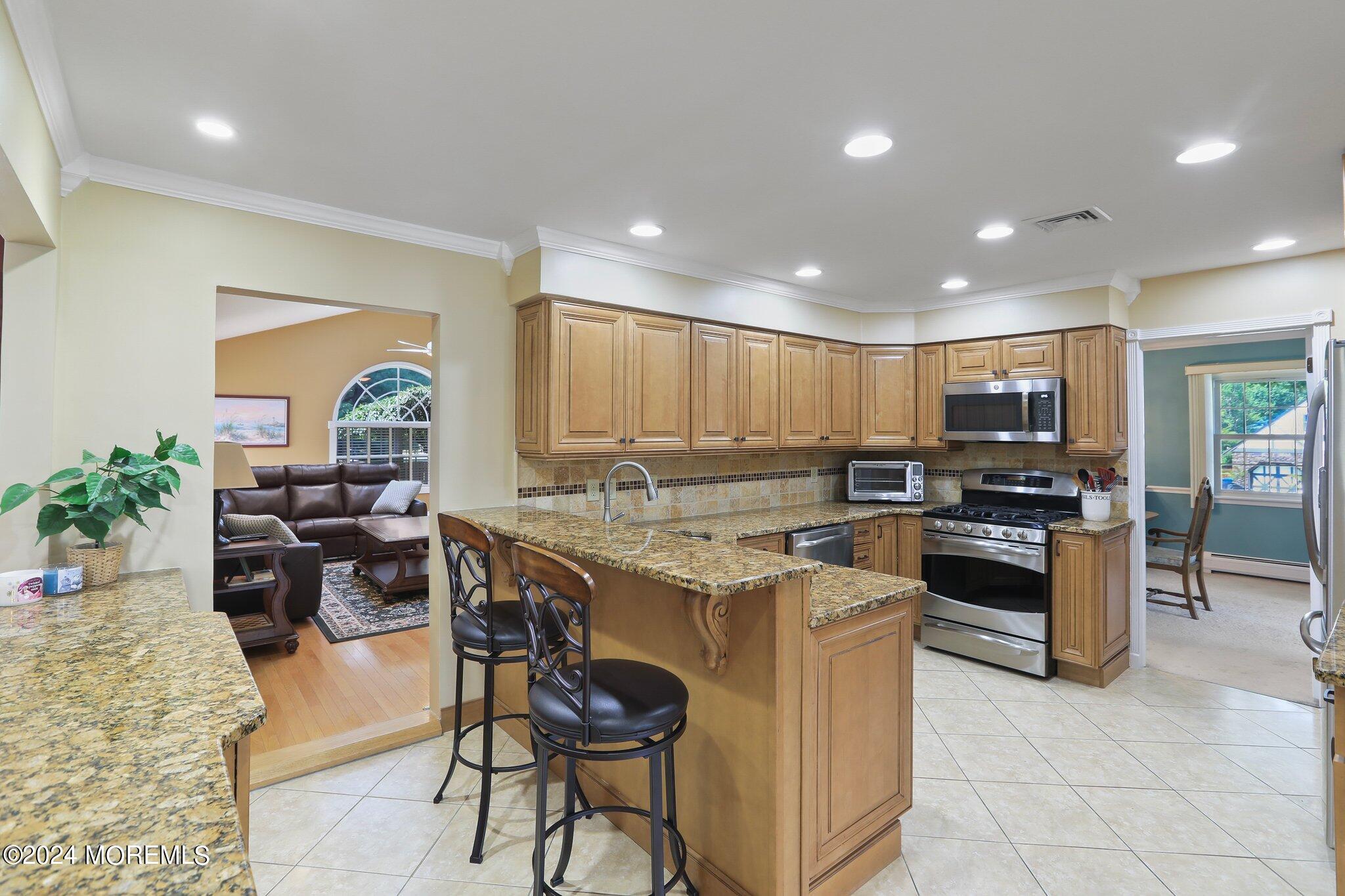 2 Cedar Court Marlboro, NJ 07746 - Photo 14 of 46 a kitchen with a sink and chairs