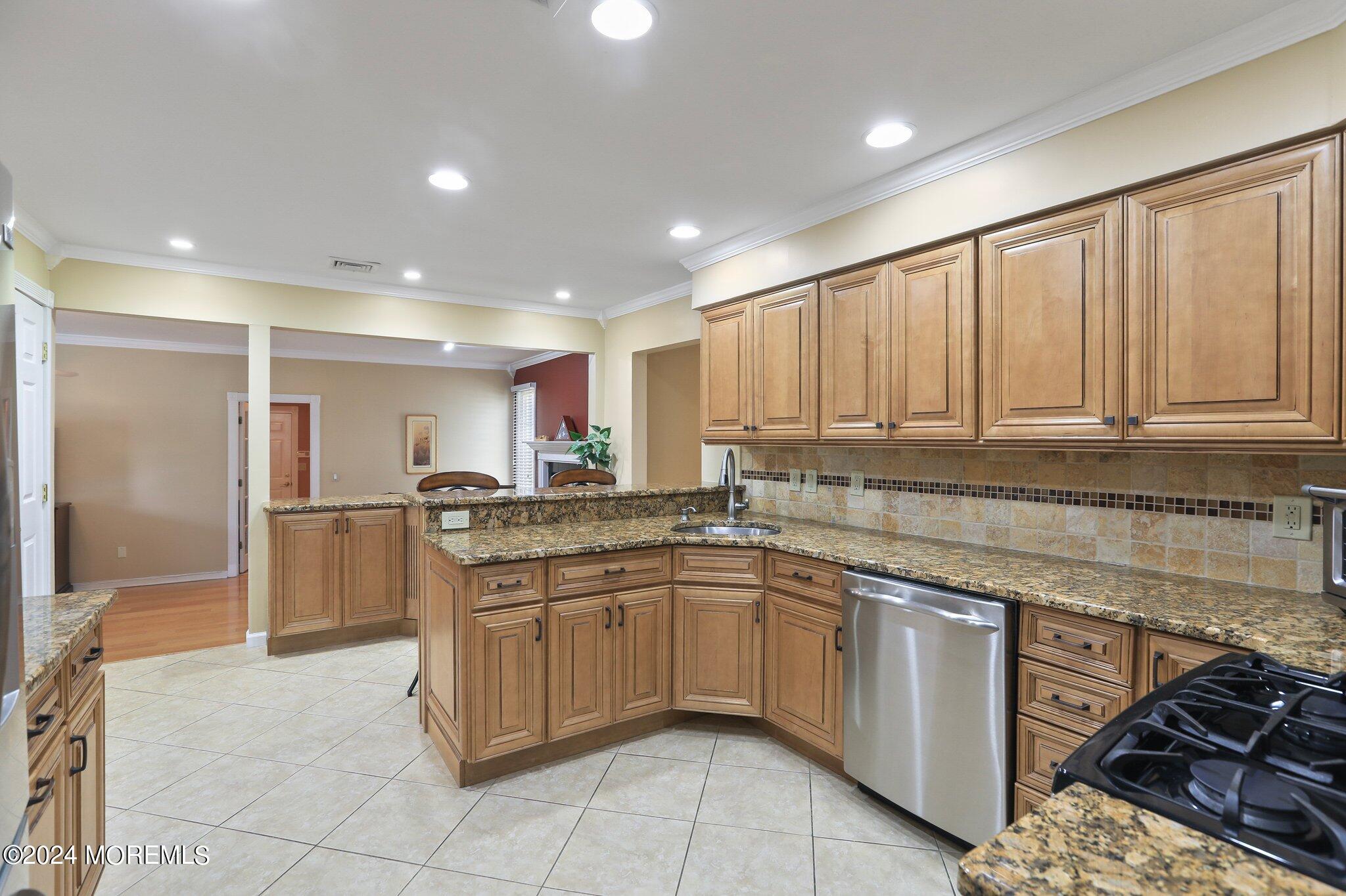 2 Cedar Court Marlboro, NJ 07746 - Photo 16 of 46 a kitchen with a sink stove and cabinets