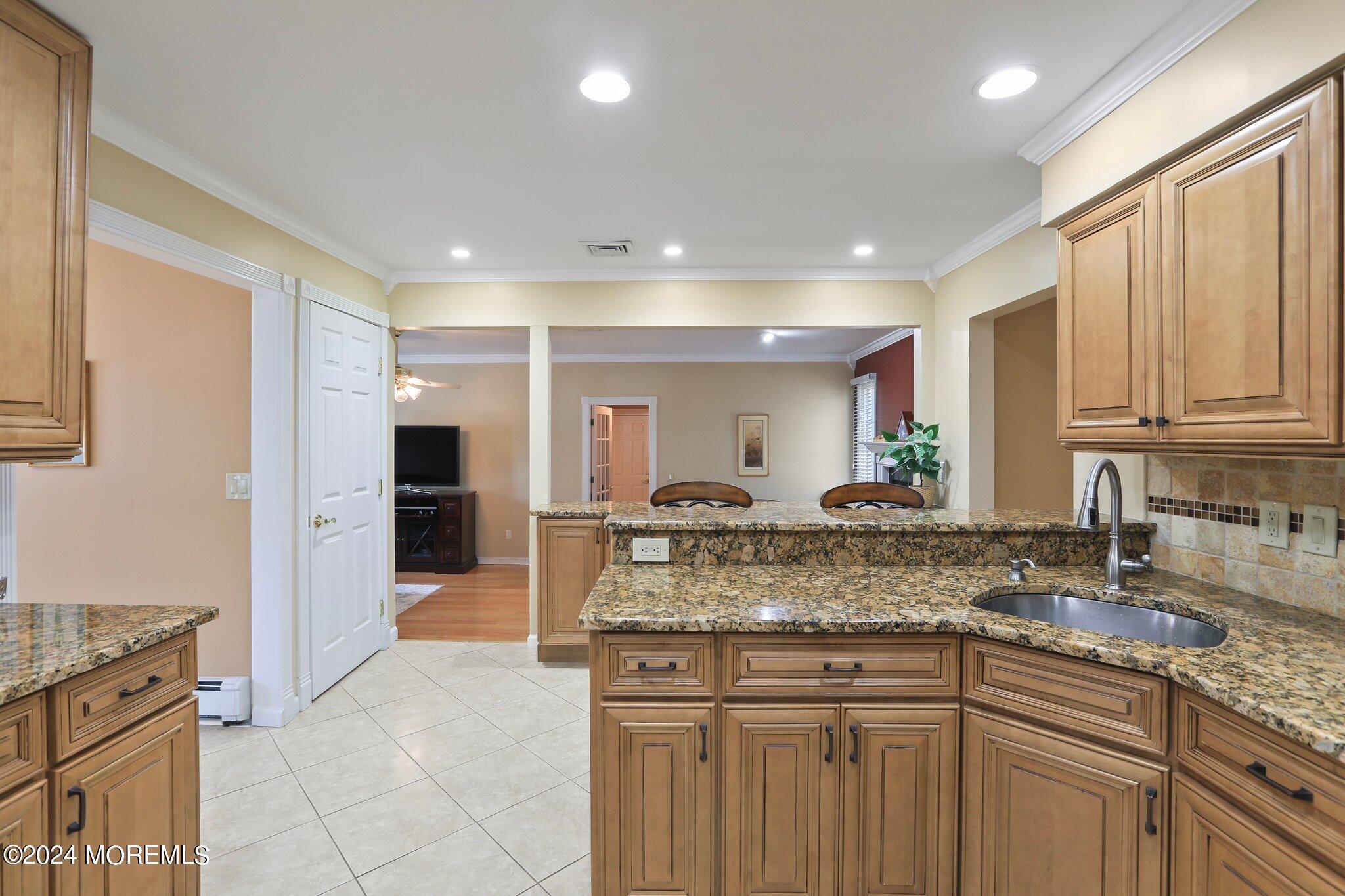 2 Cedar Court Marlboro, NJ 07746 - Photo 17 of 46 a kitchen with stainless steel appliances granite countertop a sink and cabinets