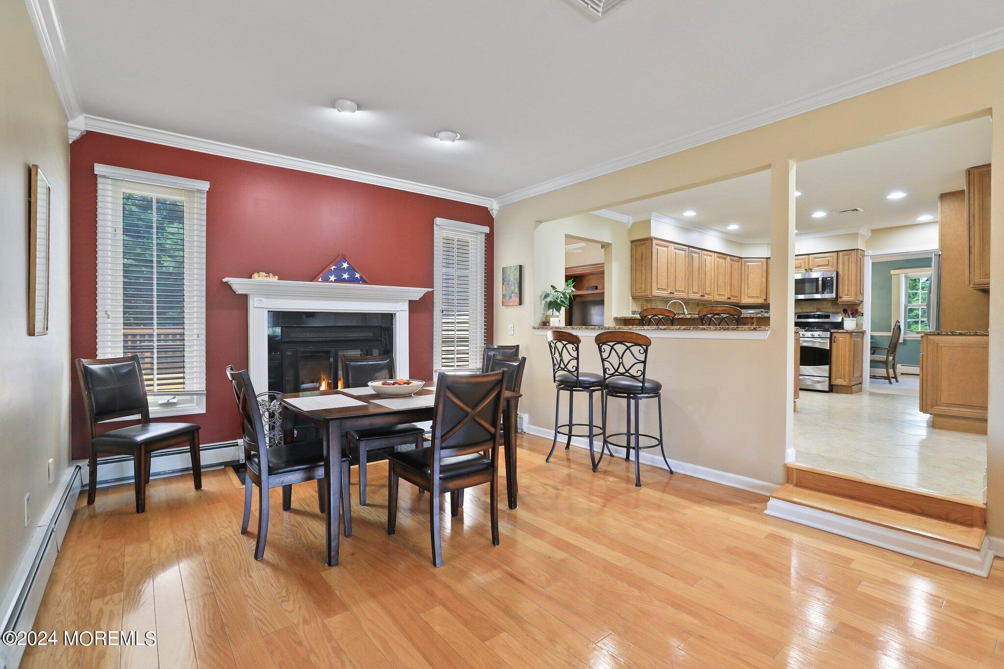 2 Cedar Court Marlboro, NJ 07746 - Photo 21 of 46 a view of a dining room with furniture window and wooden floor