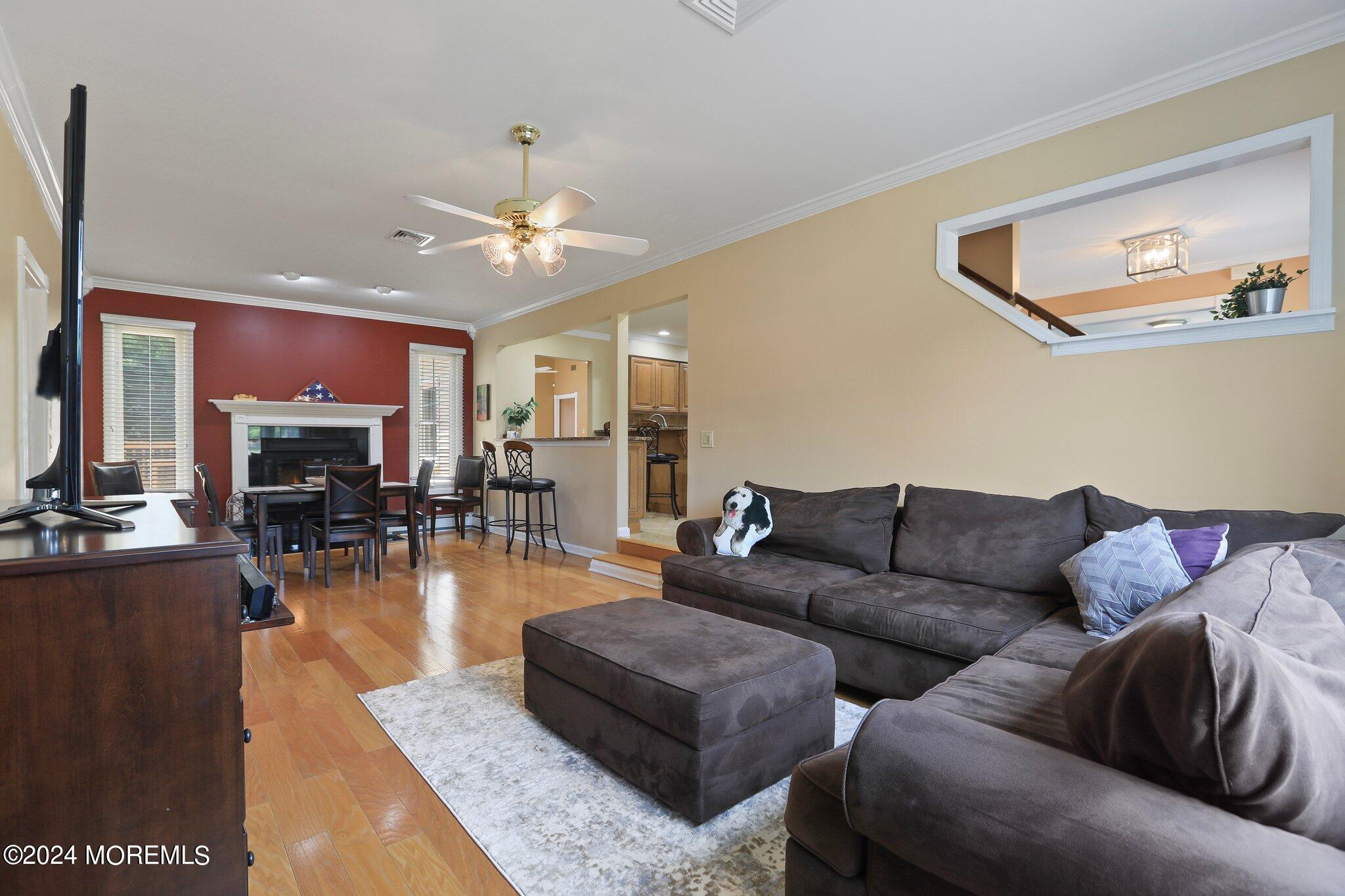 2 Cedar Court Marlboro, NJ 07746 - Photo 23 of 46 a living room with furniture kitchen view and a wooden floor