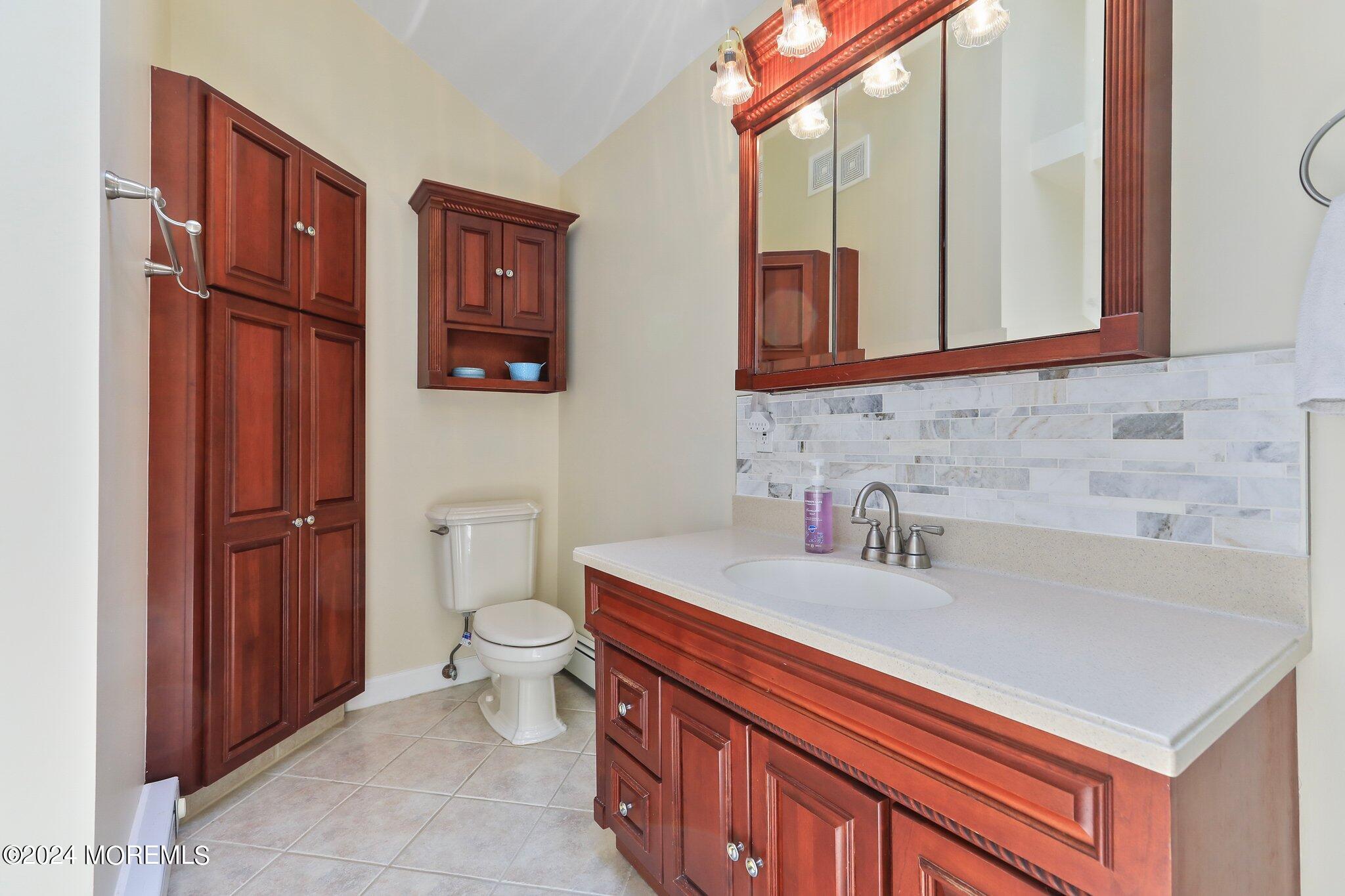 2 Cedar Court Marlboro, NJ 07746 - Photo 30 of 46 a bathroom with a sink and a toilet