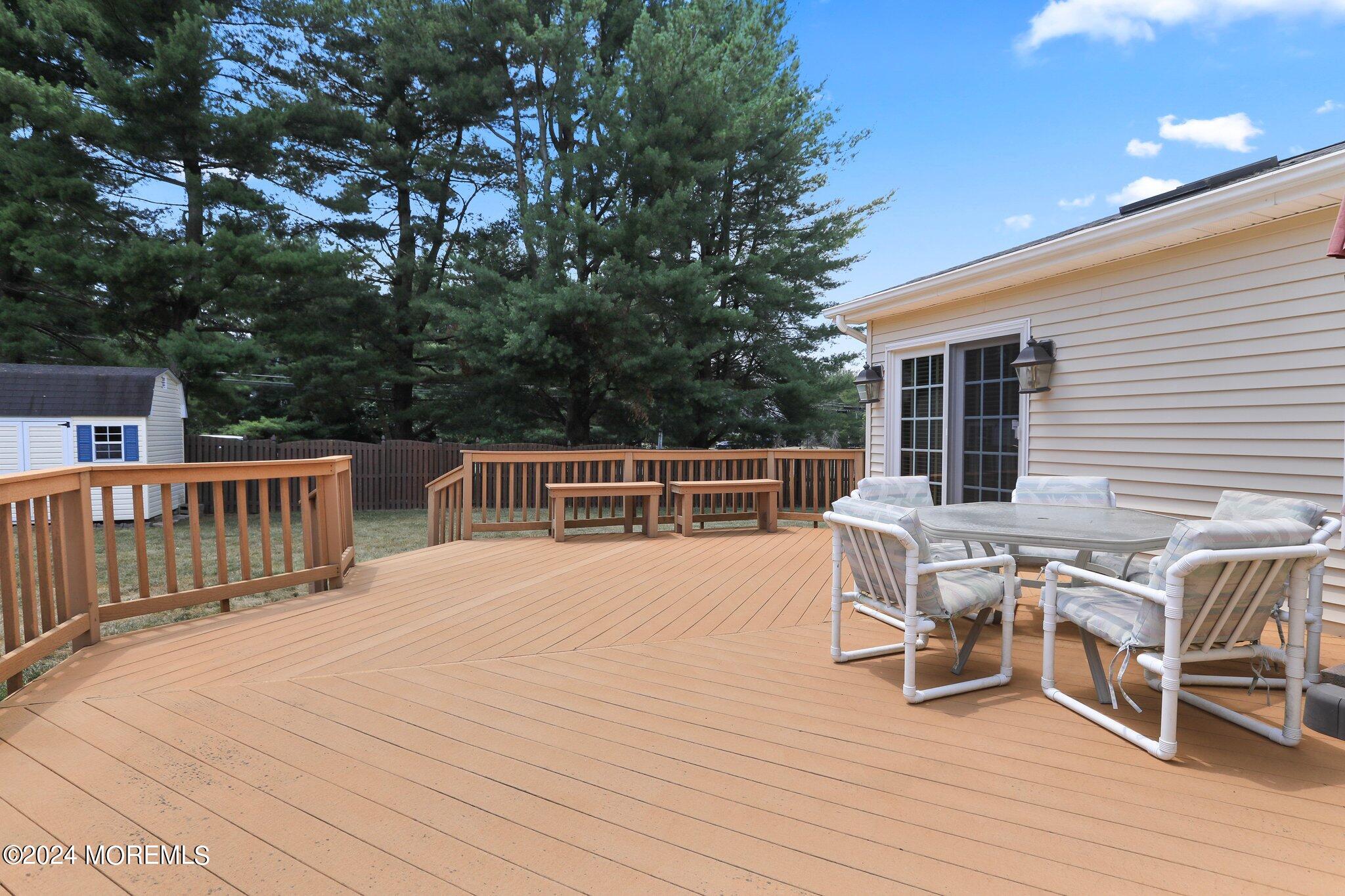 2 Cedar Court Marlboro, NJ 07746 - Photo 40 of 46 a view of a house with wooden deck and furniture