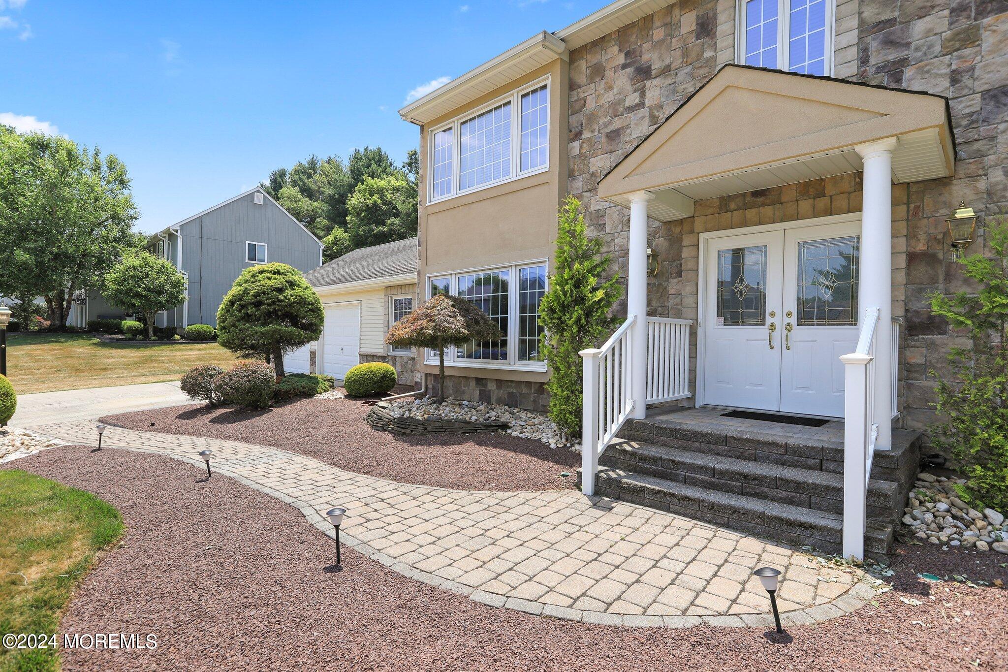 2 Cedar Court Marlboro, NJ 07746 - Photo 41 of 46 a view of a house with backyard and plants