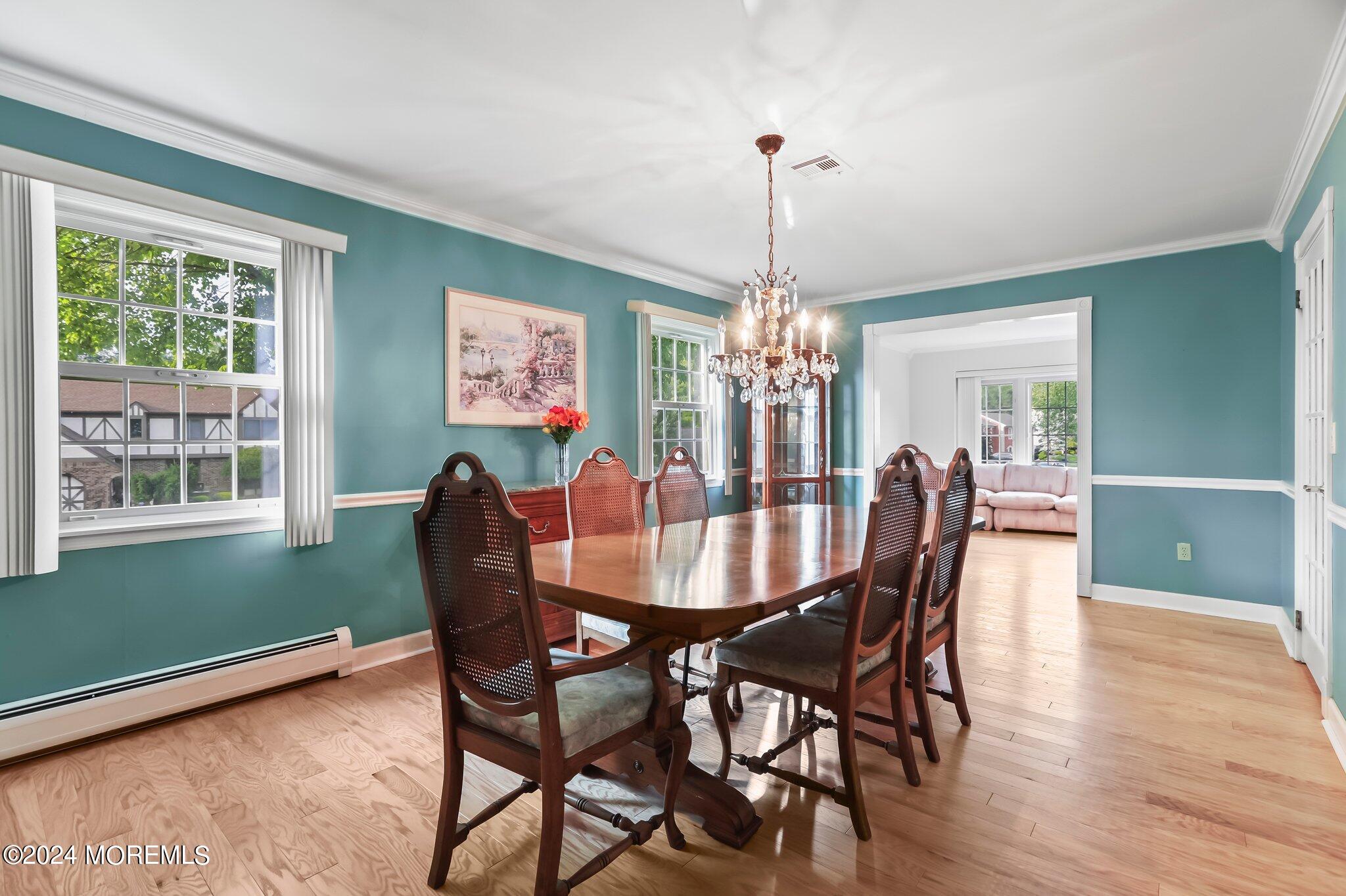 2 Cedar Court Marlboro, NJ 07746 - Photo 10 of 46 a view of a dining room with furniture window and wooden floor