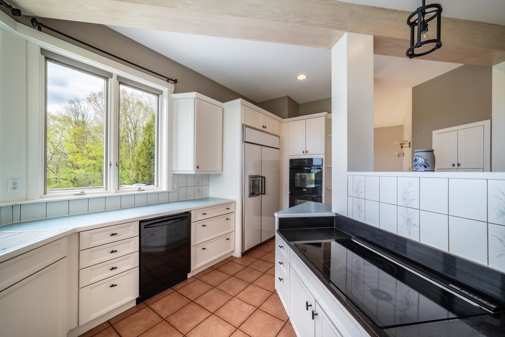 184 W Road Bernardston, MA 01337 - Photo 16 of 41 a kitchen with granite countertop cabinets stainless steel appliances a sink and a large window