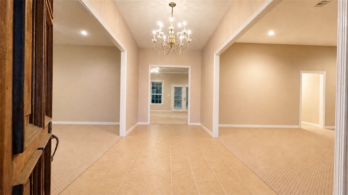 10432 Sammys Road Bremond, TX 76629 - Photo 5 of 47 wooden floor in a room with a chandelier