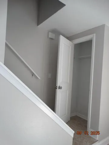 a view of hallway with closet