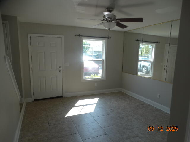 1325 Greendale Avenue, Unit 20 Fort Walton Beach, FL 32547 - Photo 2 of 30 an empty room with windows and fan