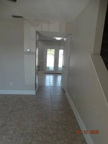 a view of hallway with a window