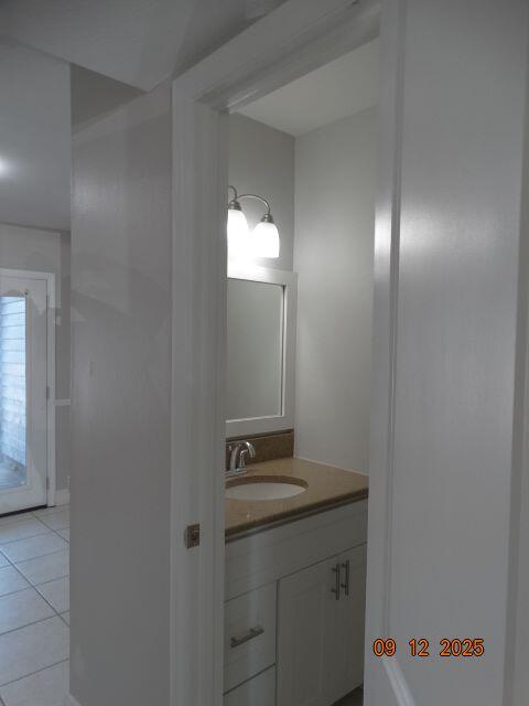 1325 Greendale Avenue, Unit 20 Fort Walton Beach, FL 32547 - Photo 10 of 30 a bathroom with a light fixture and a mirror