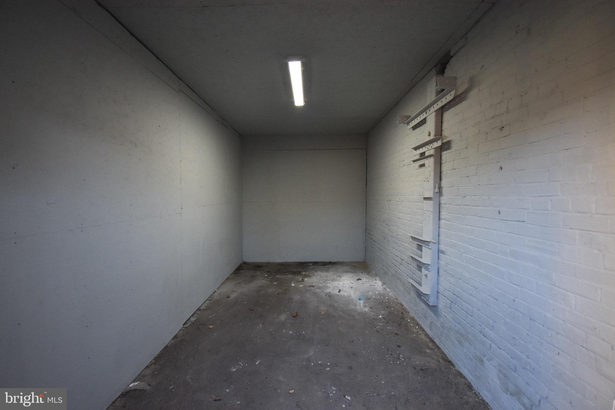 1963 Wakeling Street Philadelphia, PA 19124 - Photo 13 of 18 a view of a hallway with a window