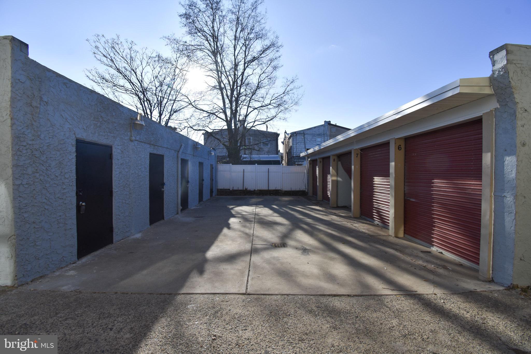 1963 Wakeling Street Philadelphia, PA 19124 - Photo 14 of 18 a view of a house with a backyard and a tree