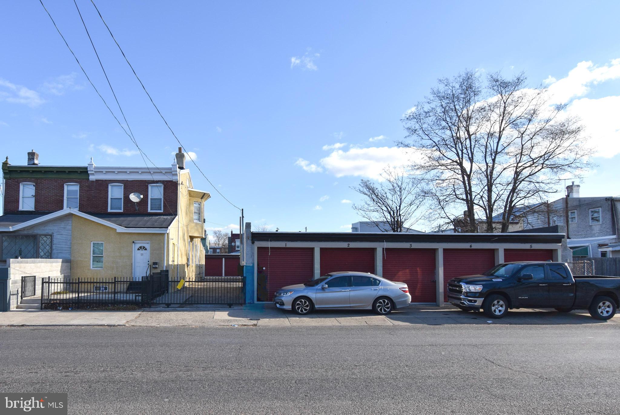 1963 Wakeling Street Philadelphia, PA 19124 - Photo 3 of 18 a car parked in front of a house