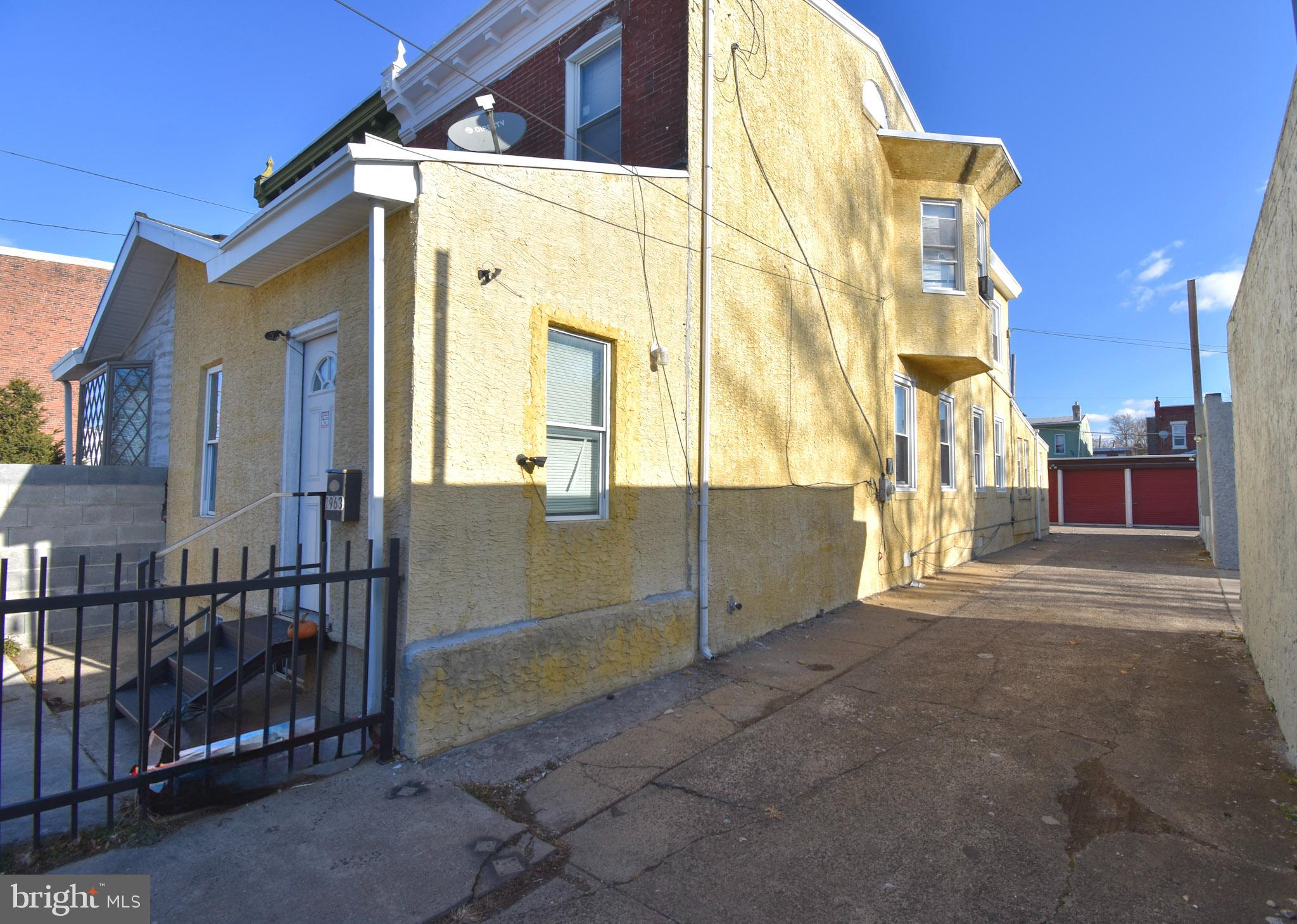 1963 Wakeling Street Philadelphia, PA 19124 - Photo 4 of 18 a view of a building with a door and a window