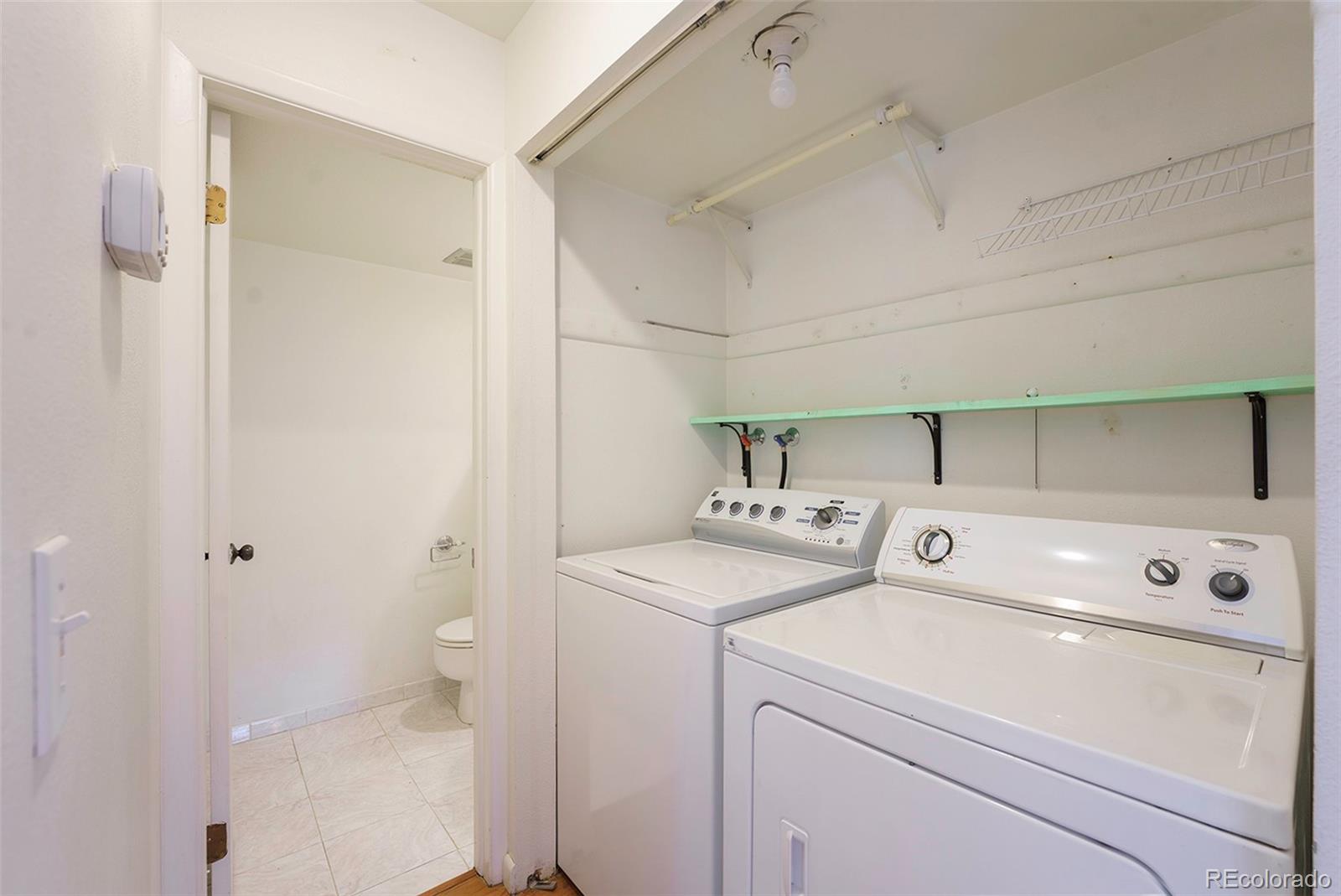 1233 South Yosemite Way, Unit 76 Denver, CO 80247 - Photo 16 of 20 a utility room with dryer and washer