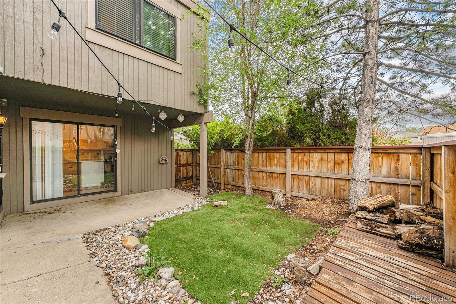 1233 South Yosemite Way, Unit 76 Denver, CO 80247 - Photo 18 of 20 a view of a backyard