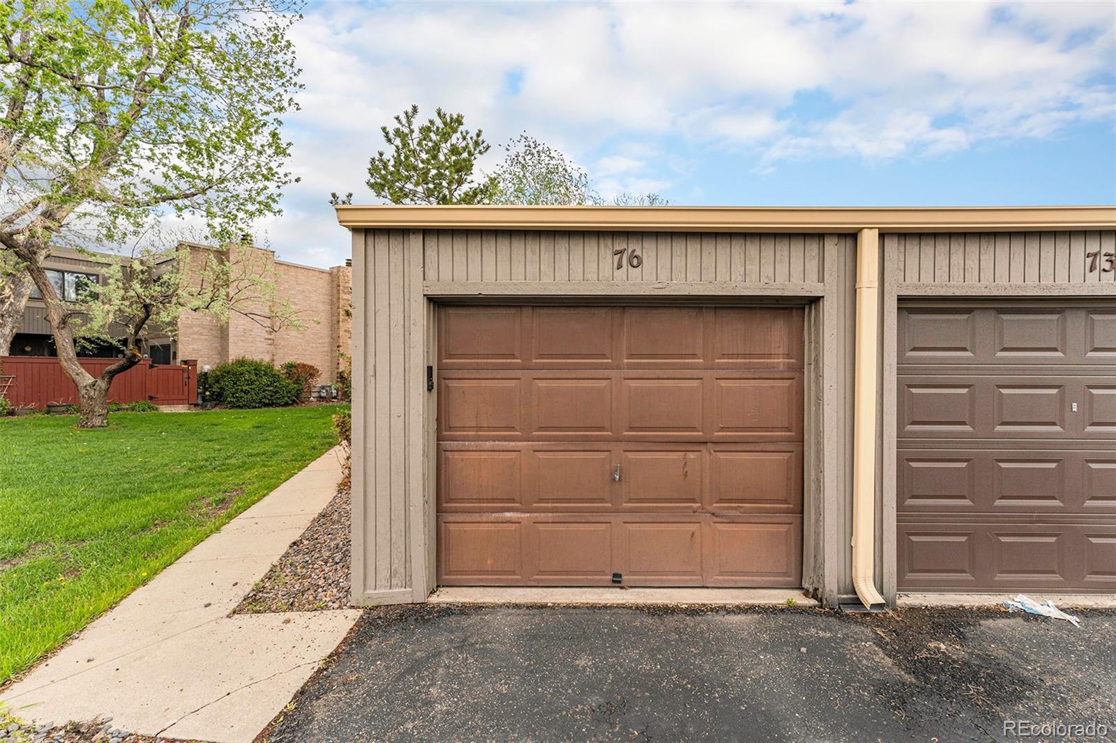 1233 South Yosemite Way, Unit 76 Denver, CO 80247 - Photo 20 of 20 a view of outdoor space garage and yard