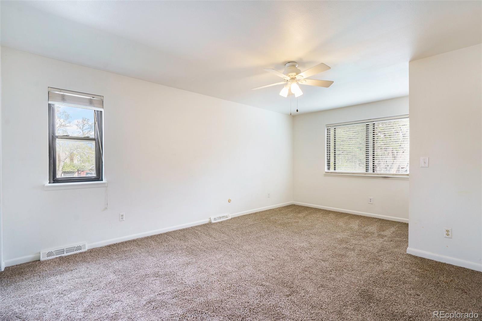 1233 South Yosemite Way, Unit 76 Denver, CO 80247 - Photo 9 of 20 a view of an empty room with a window