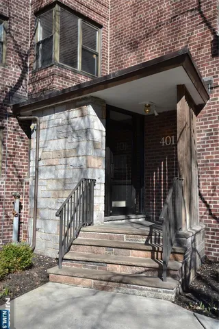 a view of house with wooden floor and a bench