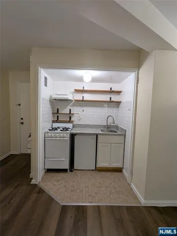 a kitchen with a stove and a sink
