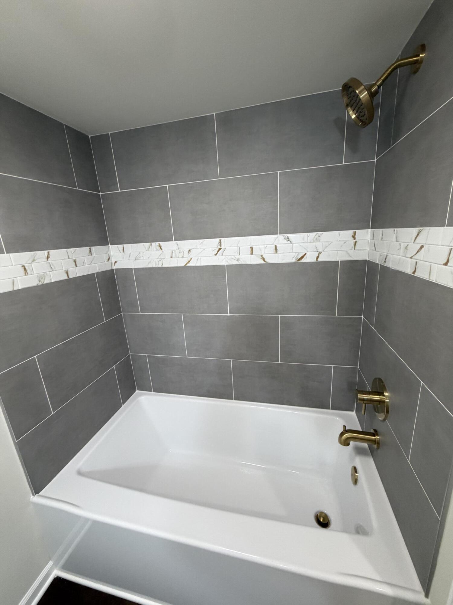 3744 Washington Street Gary, IN 46408 - Photo 17 of 25 a bathroom with a bathtub