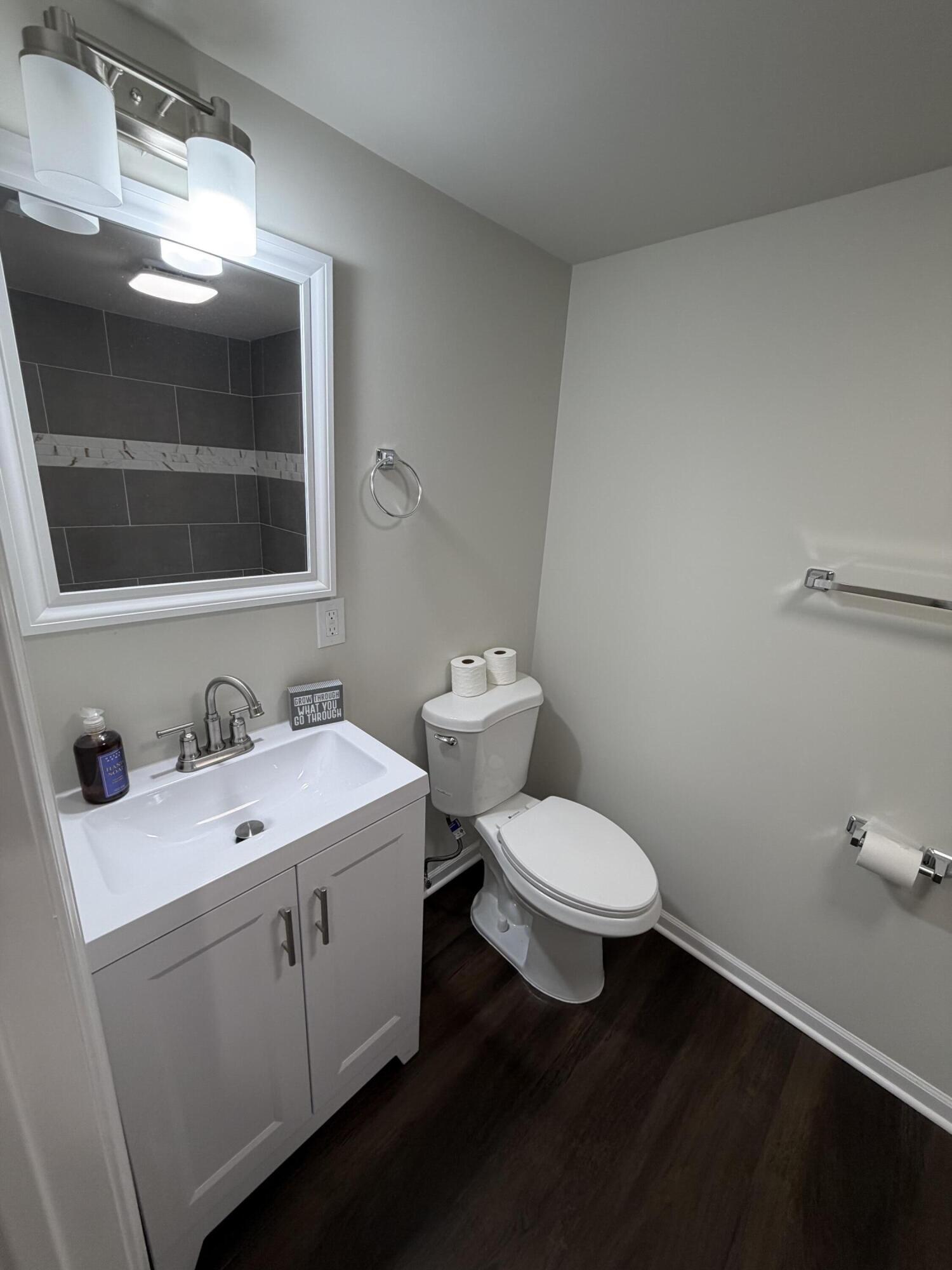 3744 Washington Street Gary, IN 46408 - Photo 18 of 25 a bathroom with a toilet sink and mirror