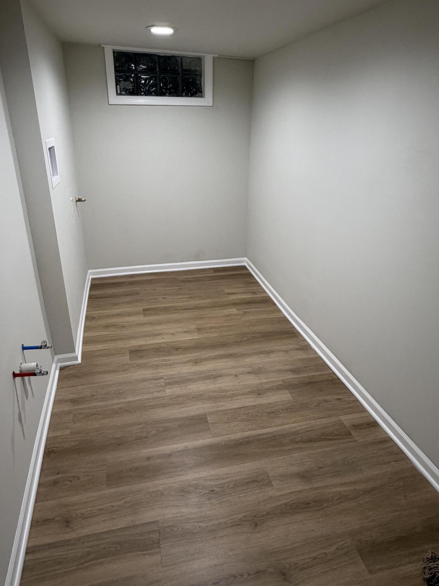 3744 Washington Street Gary, IN 46408 - Photo 20 of 25 a view of a hallway with wooden floor and staircase