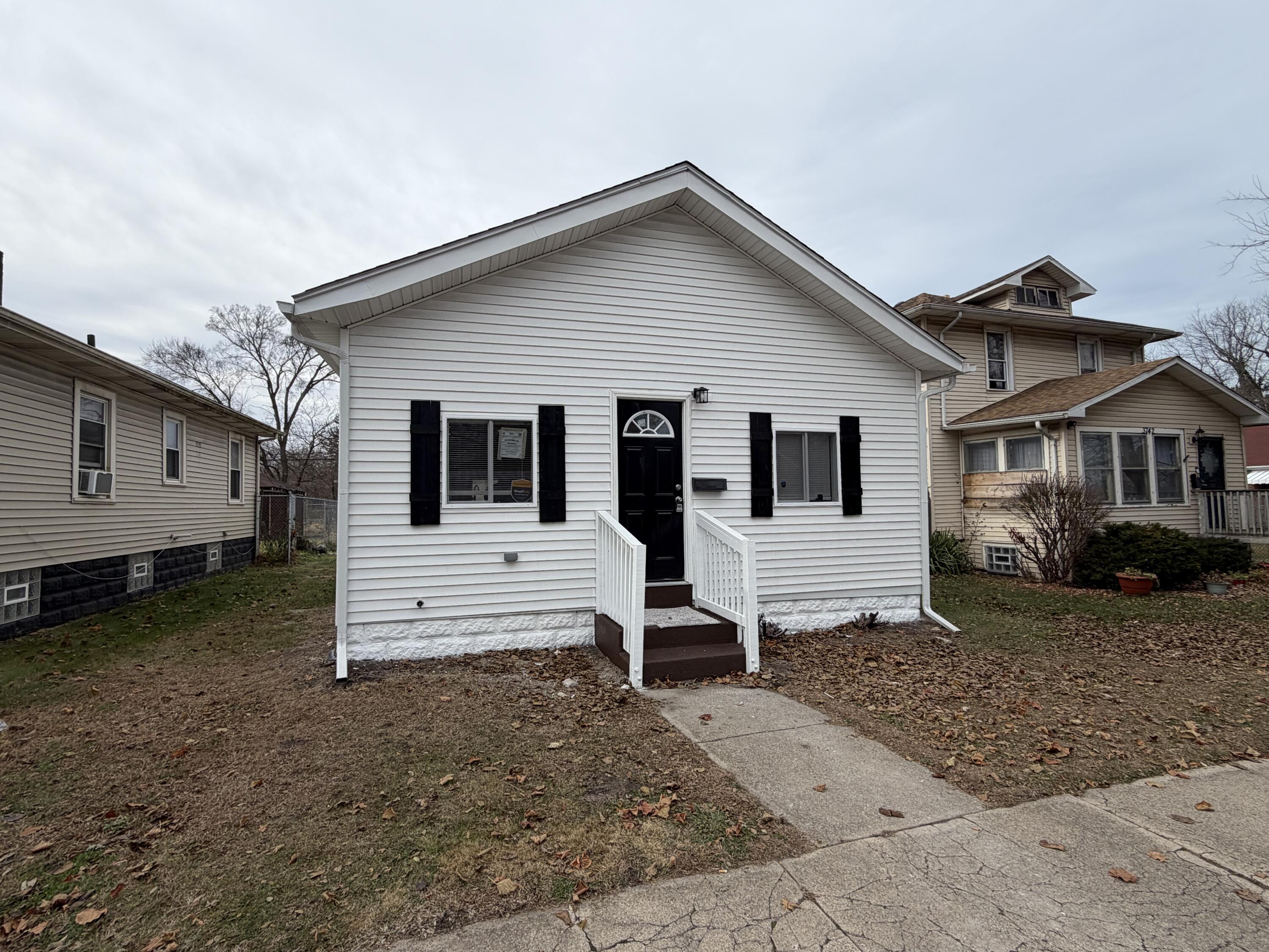 3744 Washington Street Gary, IN 46408 - Photo 21 of 25 a view of a small house with a yard