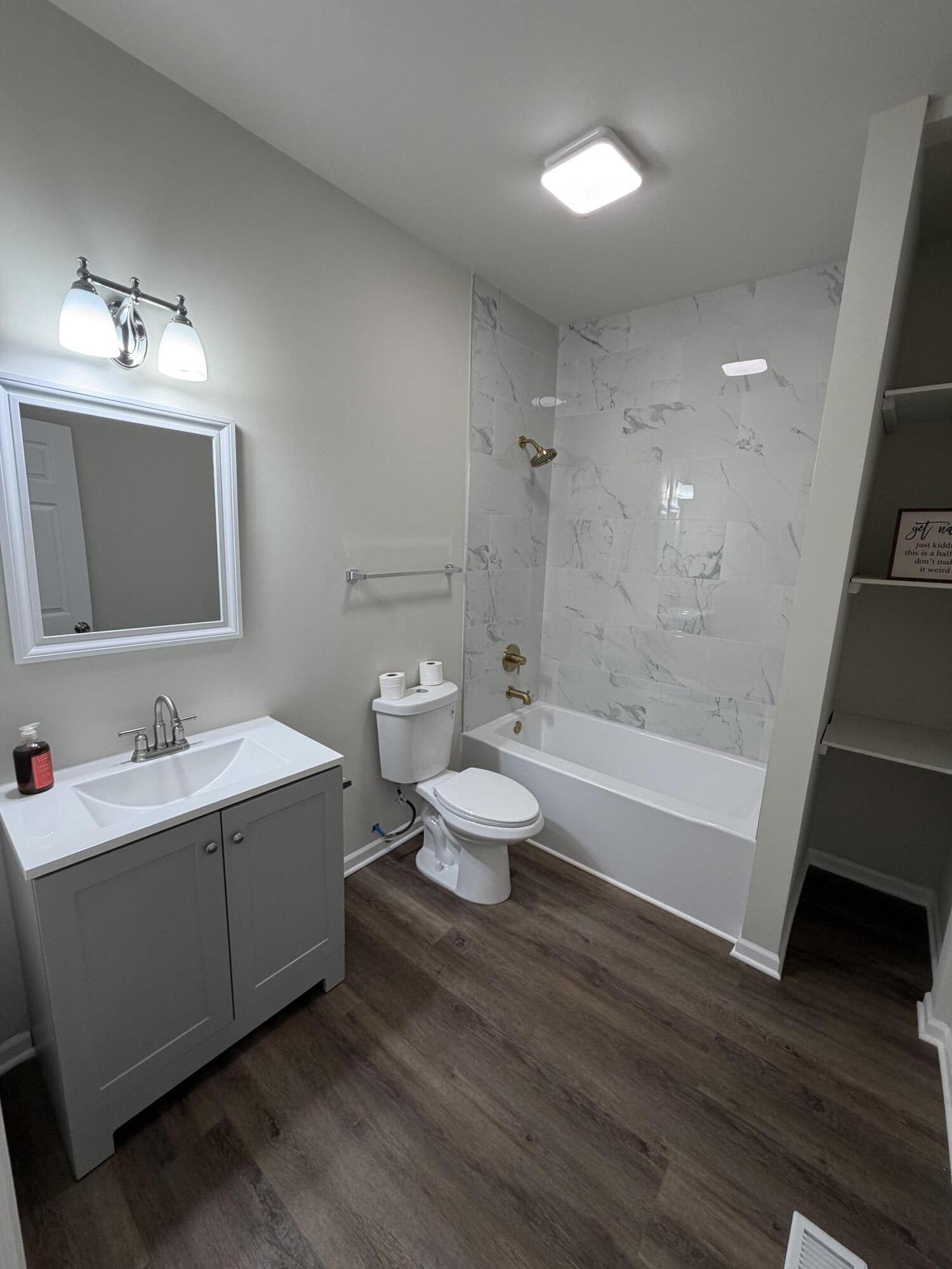 3744 Washington Street Gary, IN 46408 - Photo 8 of 25 a bathroom with a toilet sink and mirror
