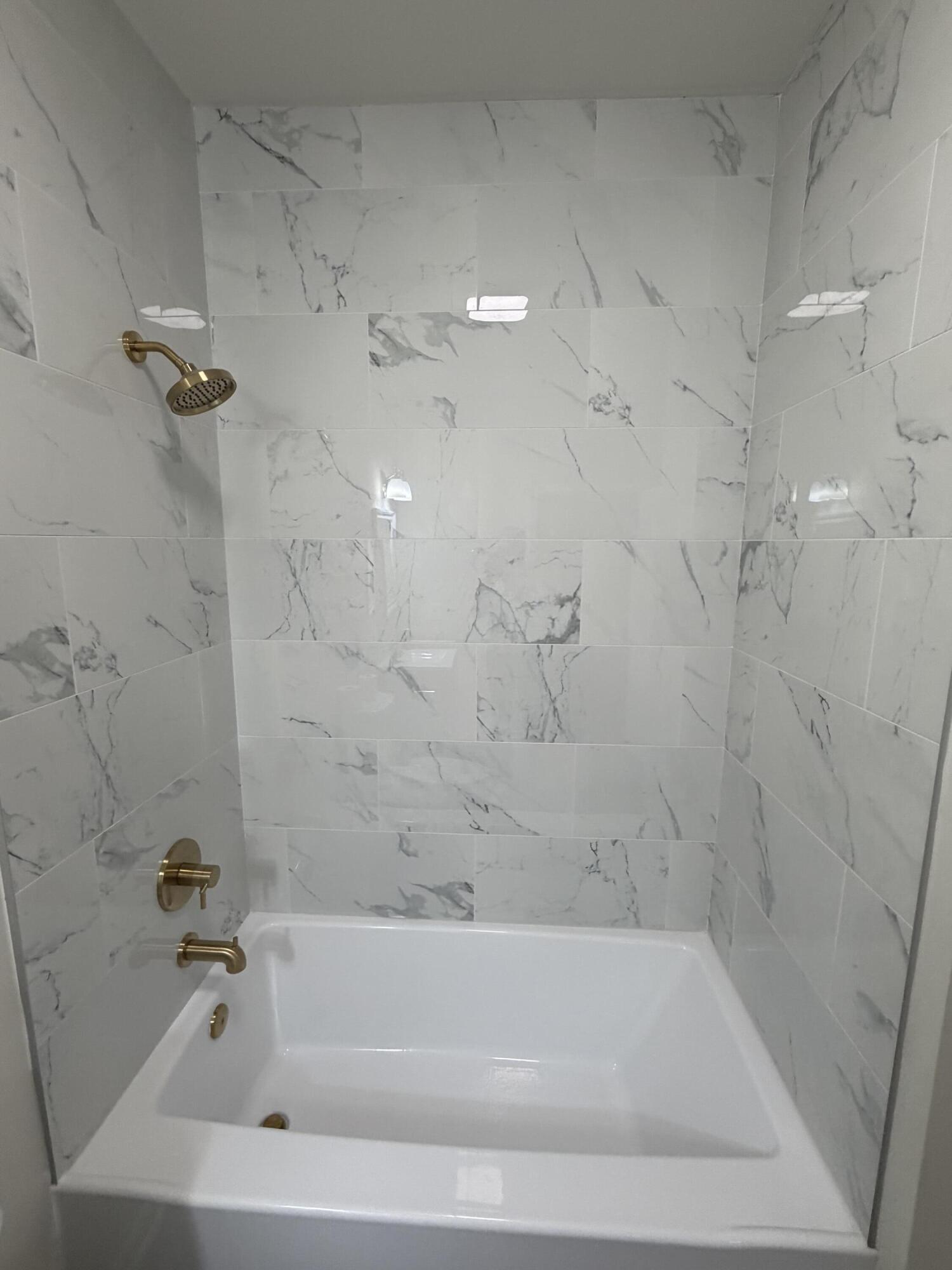 3744 Washington Street Gary, IN 46408 - Photo 9 of 25 a bathroom with a bathtub